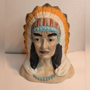 A vintage ceramic or chalkware collectible bust of a Native Aboriginal.